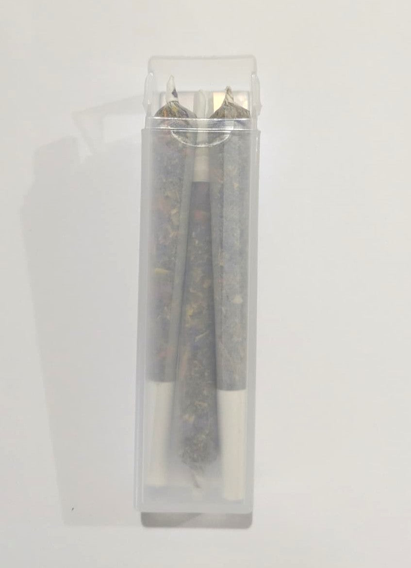 Three herbal cigarette pre rolls in a clear plastic container on a white background by Astral Herbal.