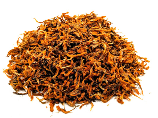 A mound of dried wild dagga flower by Astral Herbal on a white background.
