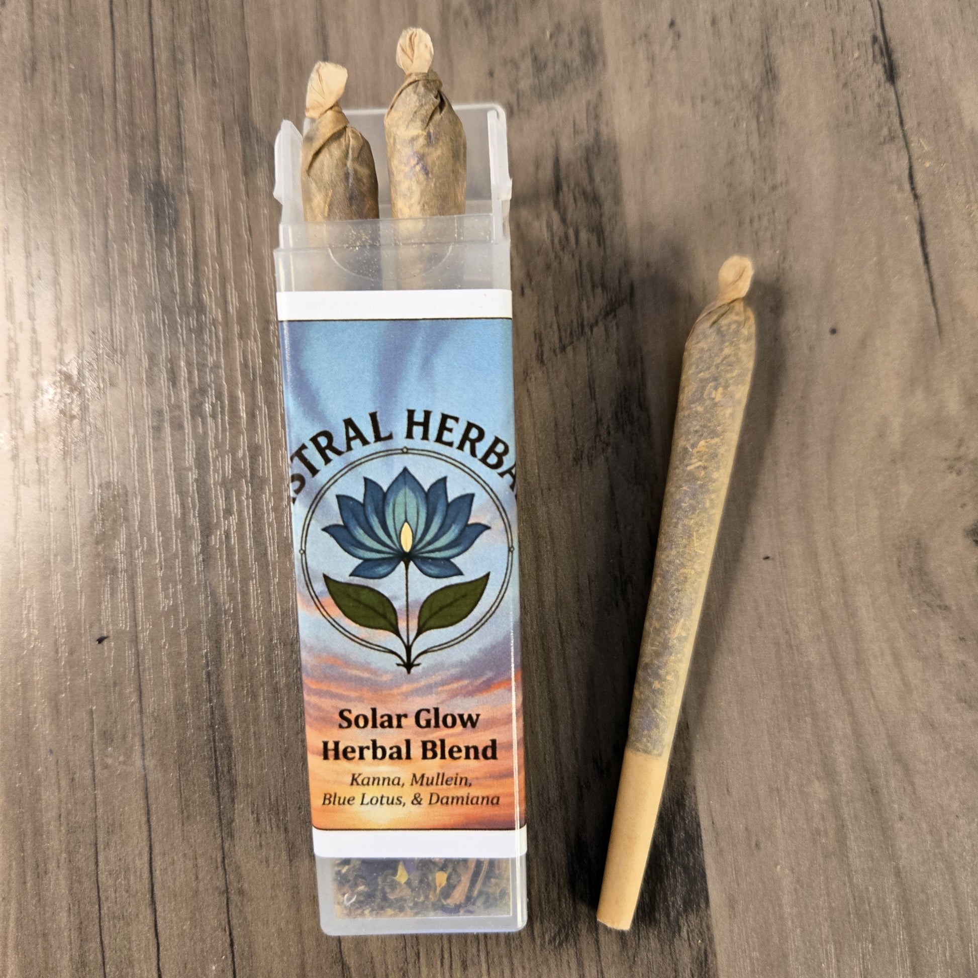 Astral Herbs Solar Glow Herbal Blend packaging with two sticks on a wooden surface