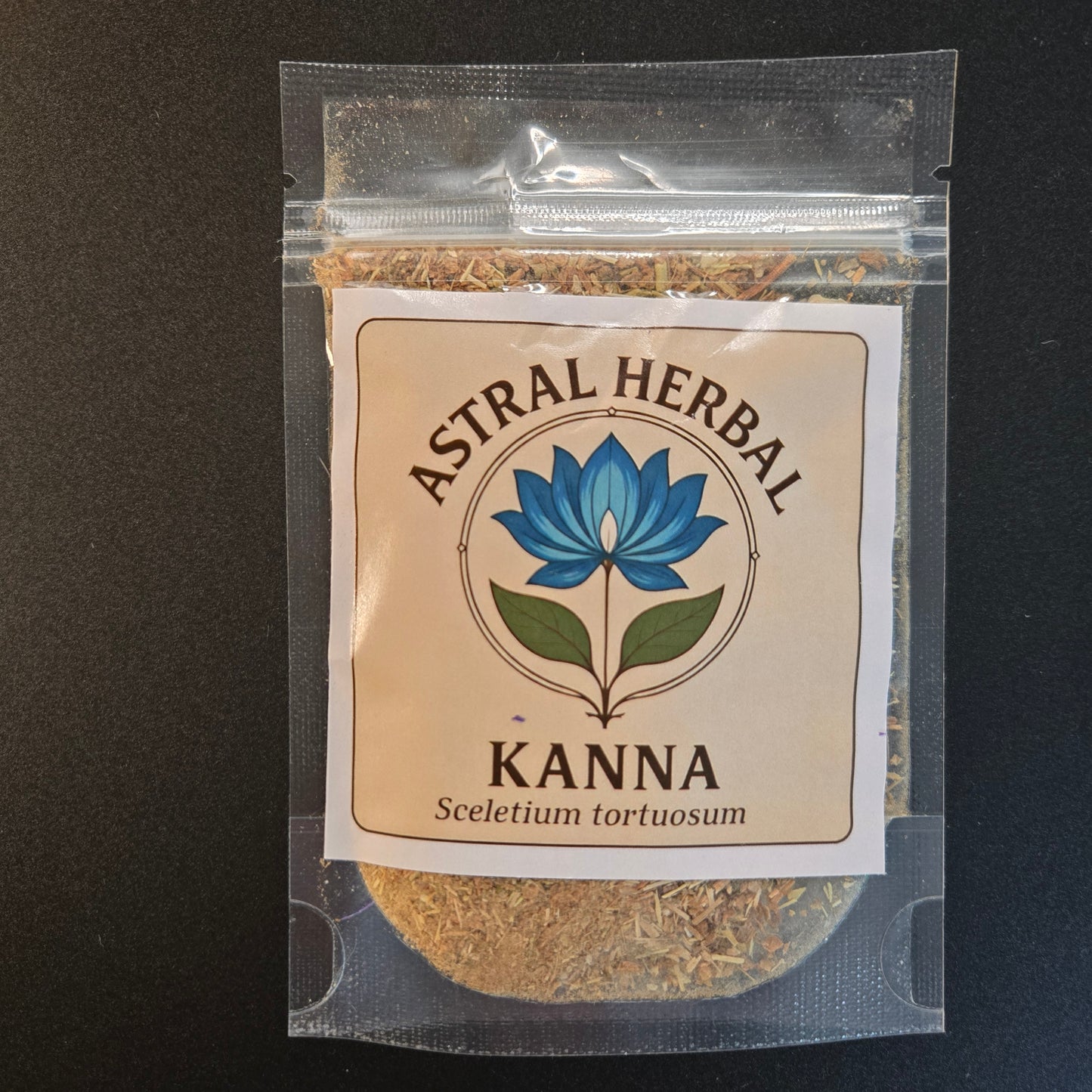 Clear plastic bag with dried kanna and a label for 'Astral Herbal Kanna' on a black background.
