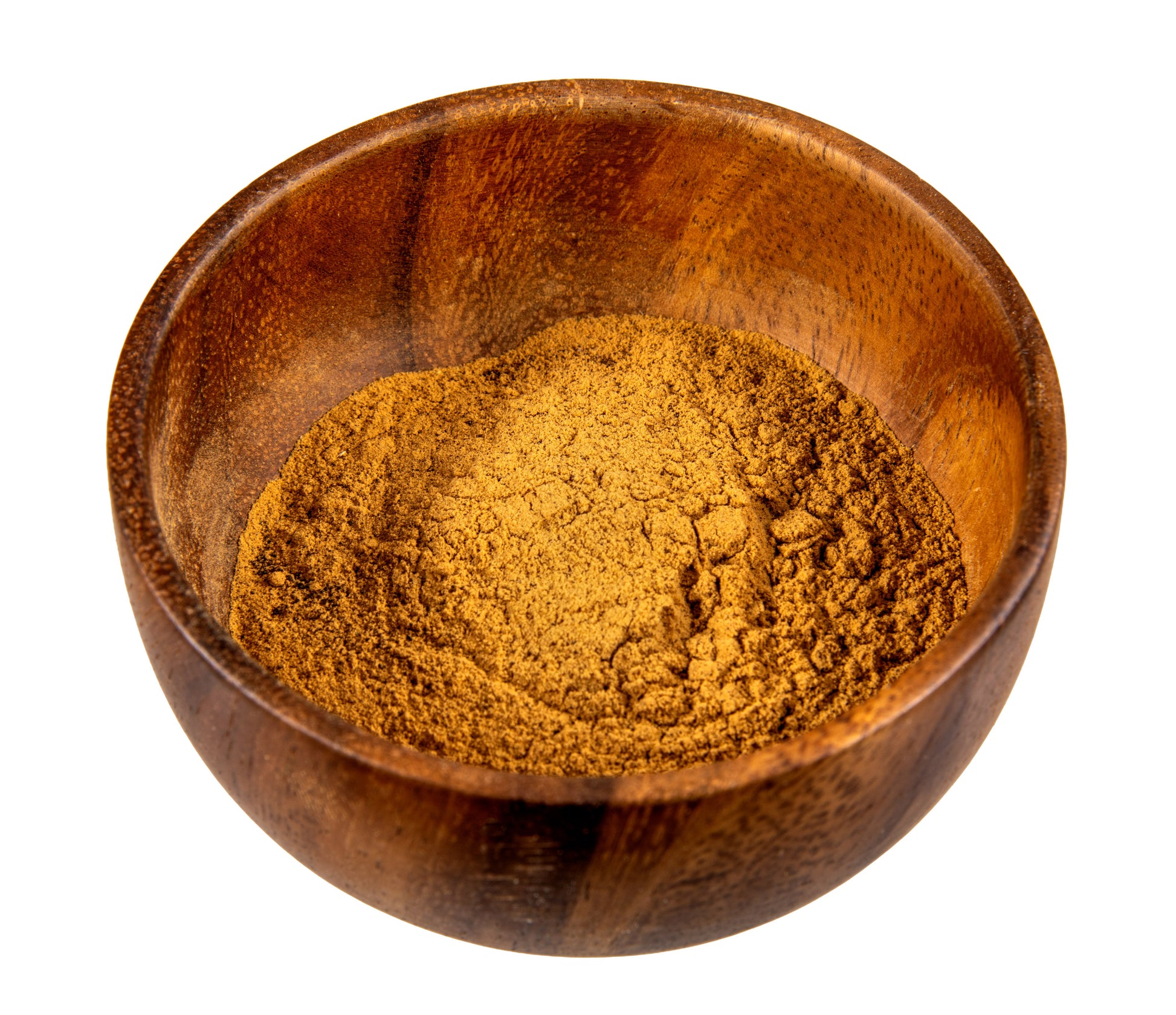 Wooden bowl filled with brown powder on a white background