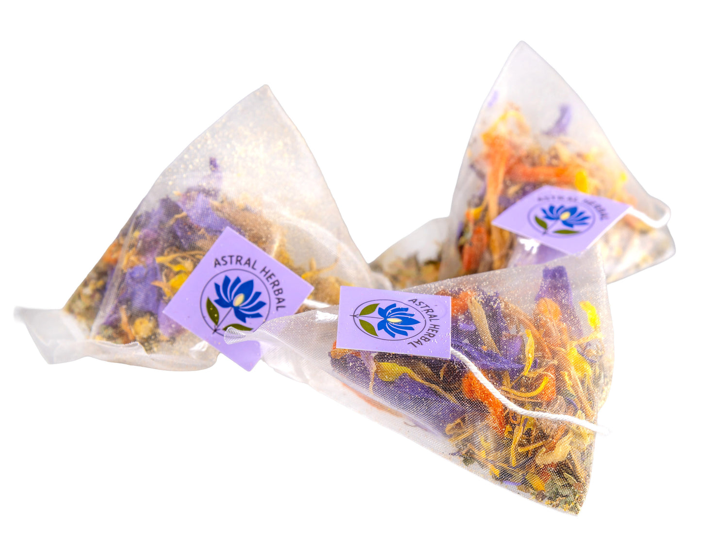 Three triangular tea bags with dried herbs and 'Astral Herbal' branding on a white background