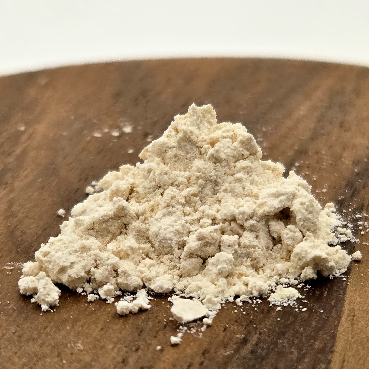 Kanna extract MT-55 on a wooden surface by Astral Herbal