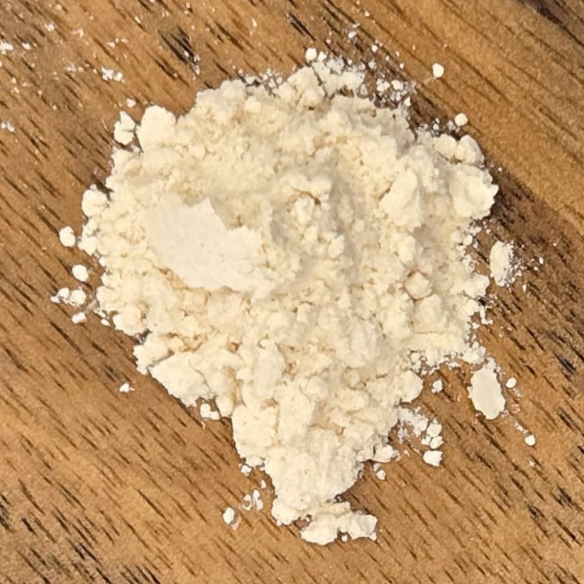 Kanna extract MT-55 on a wooden surface by Astral Herbal