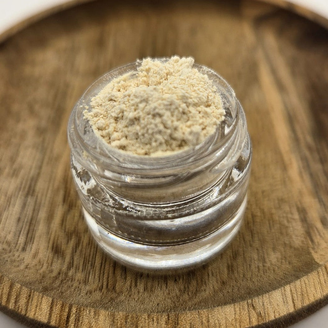 Kanna extract MT-55 in a glass jar on a wooden background by Astral Herbal.
